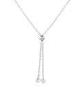 Collana saliscendi a Y in argento placcato oro bianco con cursore a sfera centrale e due catenelle pendenti con punti luce in zircone, su sfondo bianco.